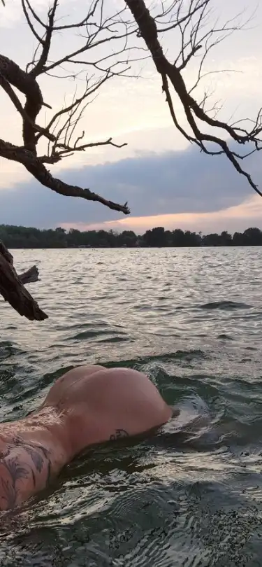 Pinkyssworld aka Miss Pinky swimming in the evening pantyless with a view