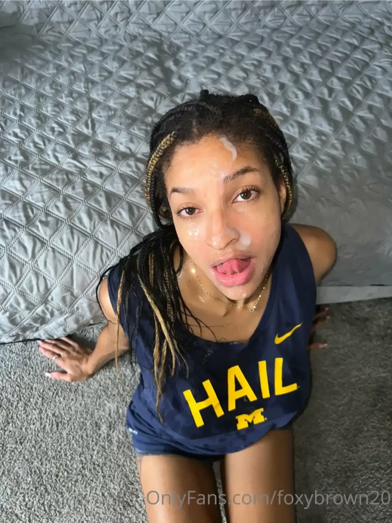 FoxyBrown20 on bed eating cum