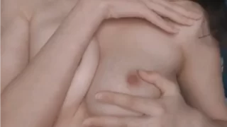 Beautiful brunette babe cuddling her perky tits
